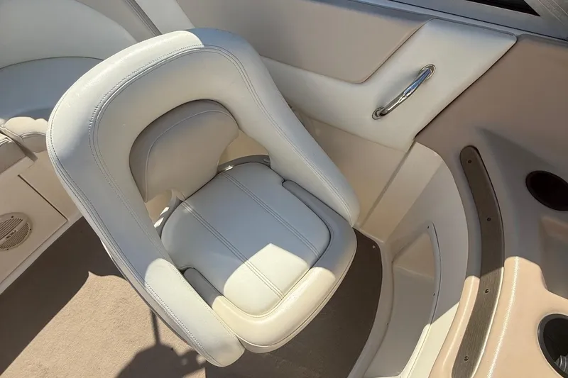 Slide: The Image of Luxurious white leather seat in a 2005 Bryant 214 boat interior. - 15