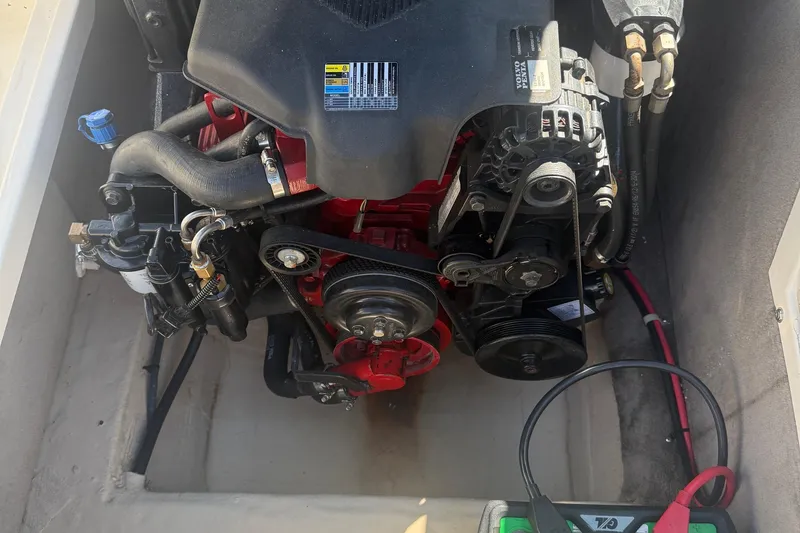Slide: The Image of Engine compartment of a 2005 Bryant 214 boat, featuring visible components and wiring. - 16