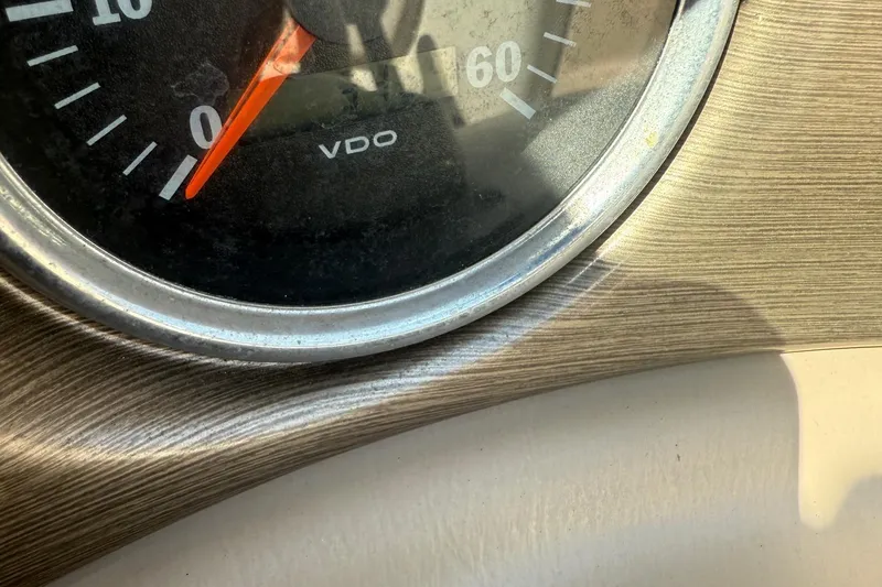 Slide: The Image of Close-up of a 2005 Bryant 214 speedometer with wood grain dashboard. - 25