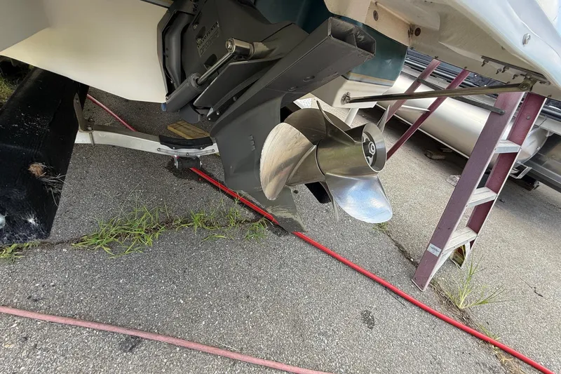 Slide: The Image of Propeller of a 2005 Bryant 214 boat on a trailer, with visible ladder and cables. - 5