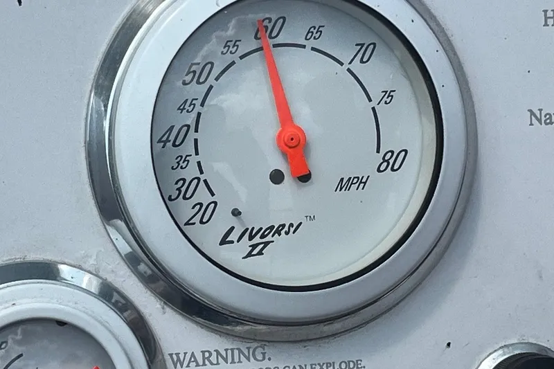 Slide: The Image of Speedometer of a 1999 Donzi 22 Classic boat, showing 60 MPH. - 13