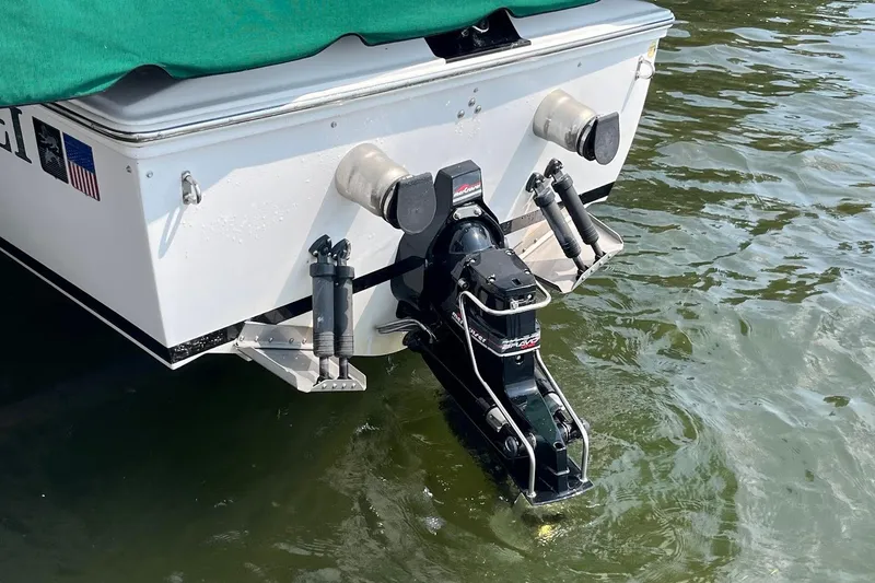 Slide: The Image of 1999 Donzi 22 Classic boat stern with outboard motor in water. - 17