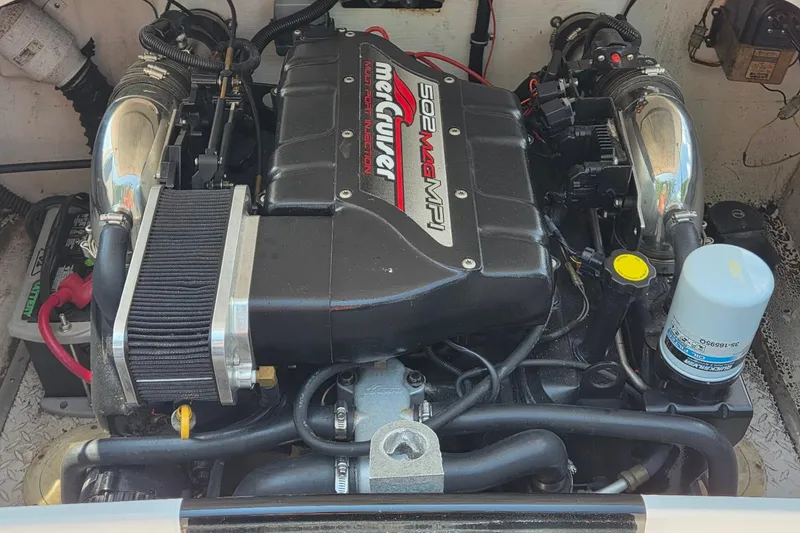 Slide: The Image of Engine of a 1999 Donzi 22 Classic boat, featuring a MerCruiser 502 Mag MPI. - 19