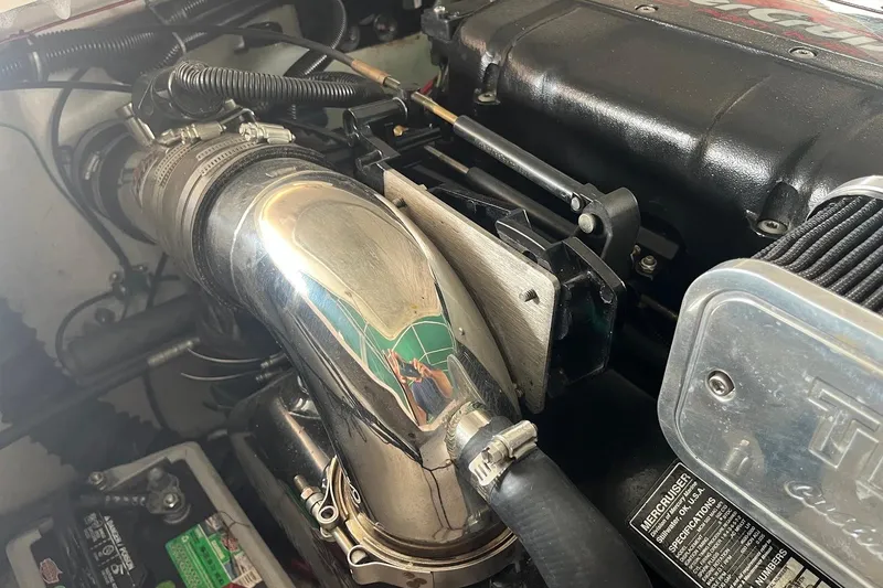 Slide: The Image of Engine compartment of a 1999 Donzi 22 Classic boat, featuring polished components. - 20