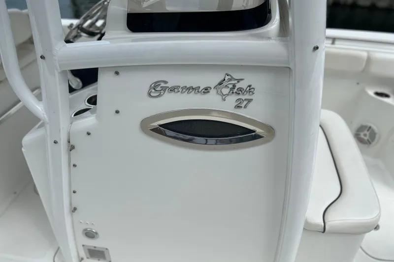 Slide: The Image of 2014 Sea Hunt Gamefish 27 boat interior detail with logo and seating. - 11