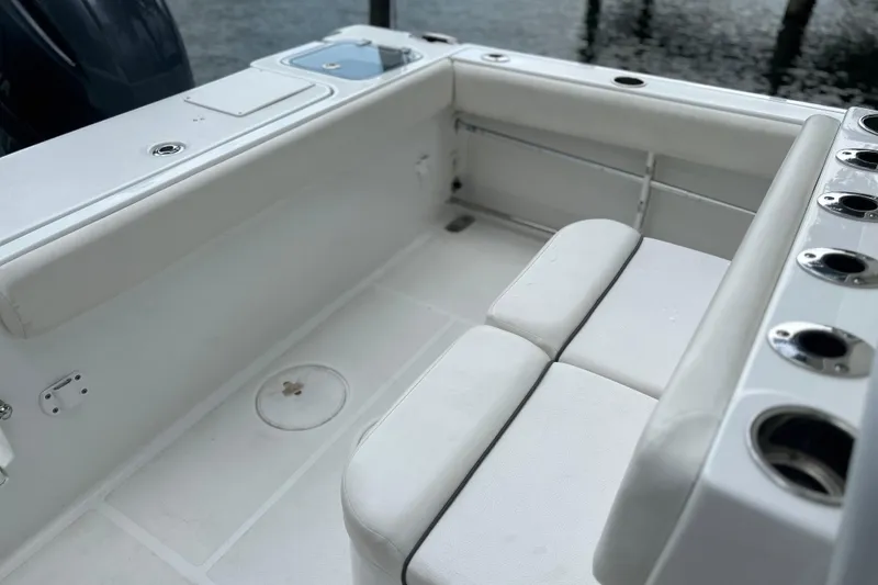 Slide: The Image of 2014 Sea Hunt Gamefish 27 boat interior with seating and rod holders. - 22