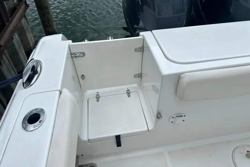 Slide: The Image of 2014 Sea Hunt Gamefish 27 boat interior with seating and storage compartments. - 24