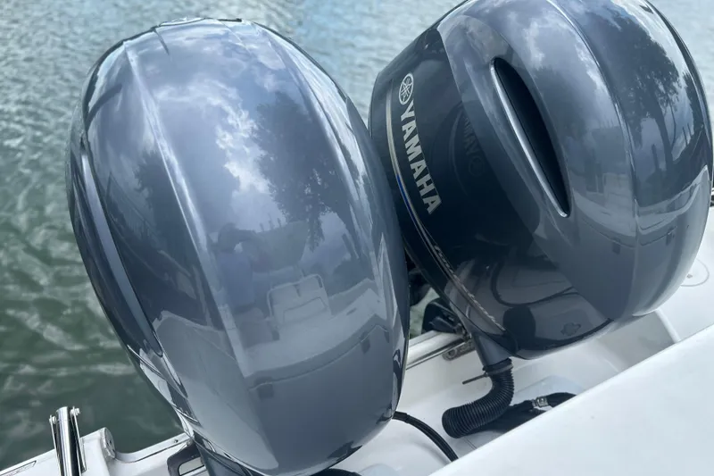 Slide: The Image of Twin Yamaha outboard motors on a 2014 Sea Hunt Gamefish 27 boat. - 25