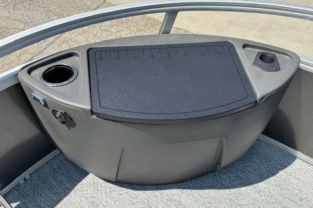 Slide: The Image of 2026 Sun Tracker Bass Buggy 18 DLX boat console with cup holders and storage. - 12