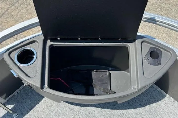 Slide: The Image of Open storage compartment on 2026 Sun Tracker Bass Buggy 18 DLX pontoon boat. - 13