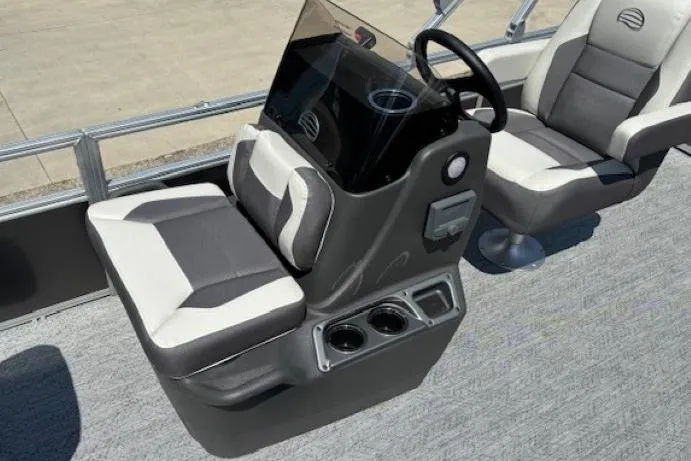 Slide: The Image of 2026 Sun Tracker Bass Buggy 18 DLX boat interior with steering console and seating. - 15