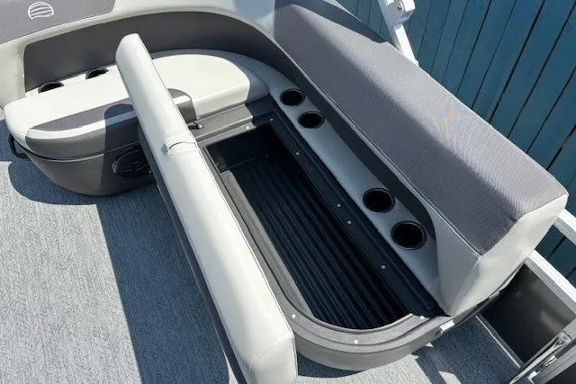 Slide: The Image of 2026 Sun Tracker Bass Buggy 18 DLX boat seating with storage and cup holders. - 18