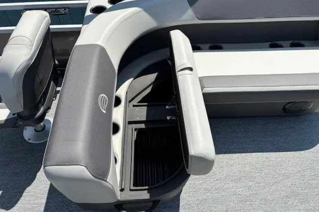 Slide: The Image of 2026 Sun Tracker Bass Buggy 18 DLX boat interior with open storage compartment. - 19