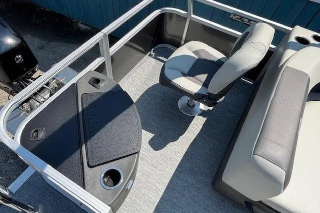 Slide: The Image of 2026 Sun Tracker Bass Buggy 18 DLX interior with seating and fishing station. - 24