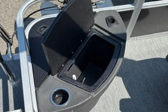 Slide: The Image of Open storage compartment on 2026 Sun Tracker Bass Buggy 18 DLX pontoon boat. - 25