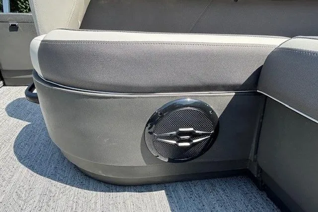 Slide: The Image of 2026 Sun Tracker Bass Buggy 18 DLX boat interior with speaker detail. - 27