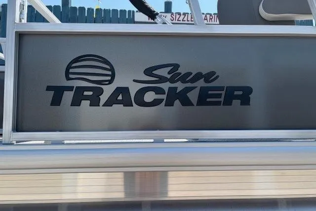 Slide: The Image of 2026 Sun Tracker Bass Buggy 18 DLX logo on boat exterior. - 4