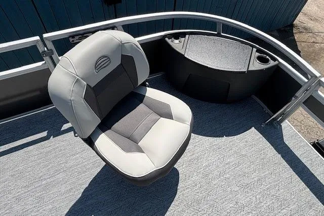Slide: The Image of 2026 Sun Tracker Bass Buggy 18 DLX boat seat with gray upholstery and railing. - 9