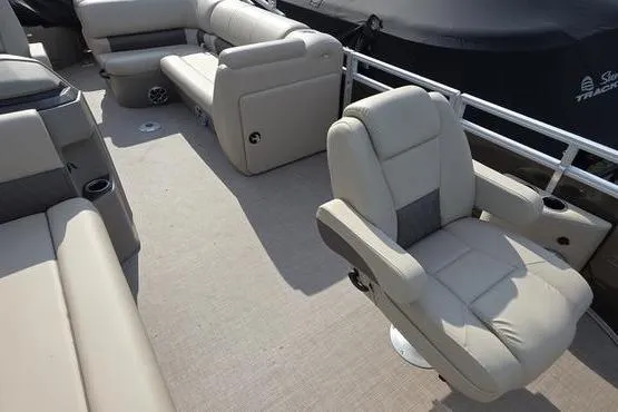 Slide: The Image of 2025 Sun Tracker Sportfish™ 20 DLX boat interior with plush seating and modern design. - 10