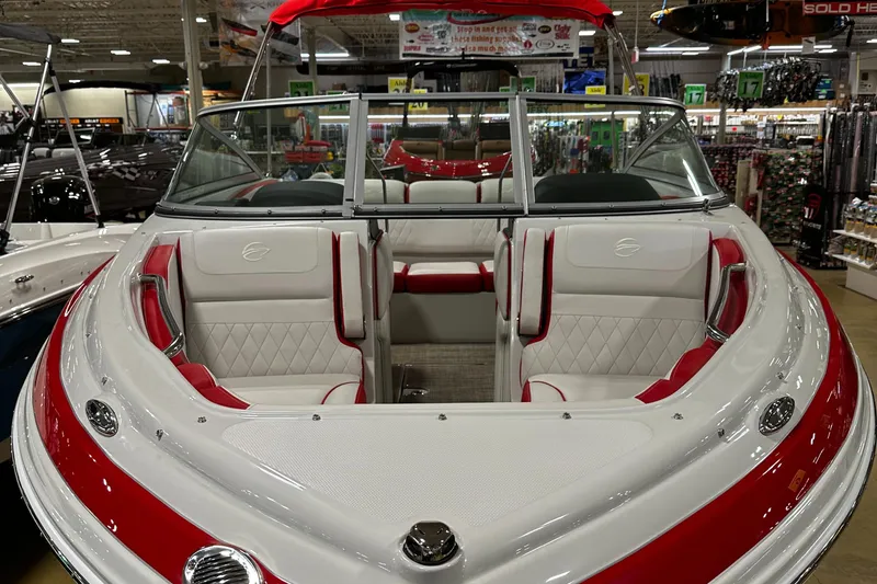 Slide: The Image of 2024 Crownline 200SS boat with red and white interior on display. - 3