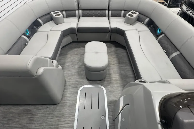 Slide: The Image of 2020 Bennington 23 SXPD boat interior with gray seating and cup holders. - 10