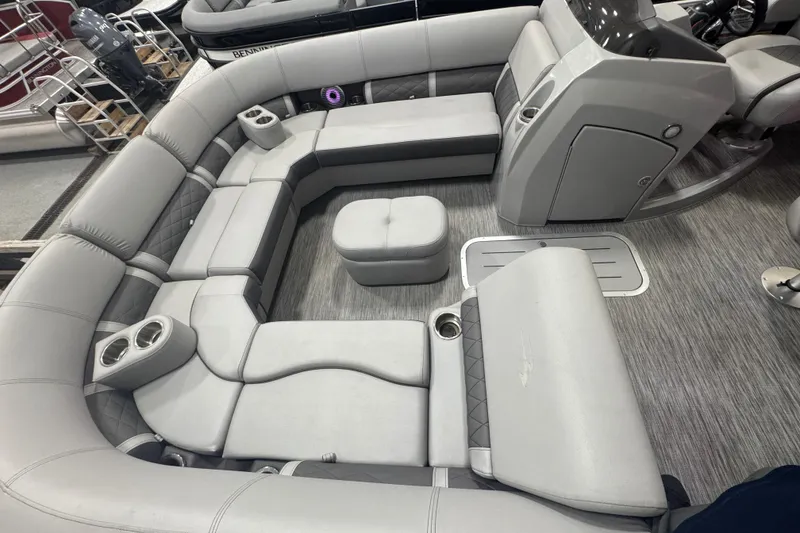 Slide: The Image of 2020 Bennington 23 SXPD pontoon boat interior with gray seating and cup holders. - 11
