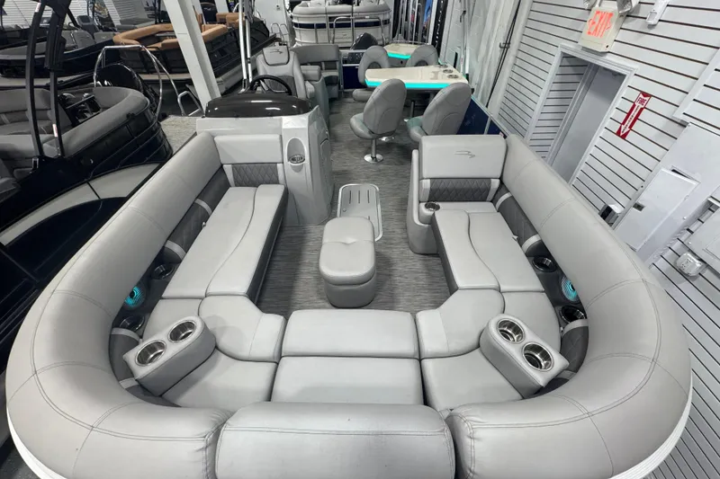 Slide: The Image of 2020 Bennington 23 SXPD pontoon boat interior with luxurious gray seating and cup holders. - 16