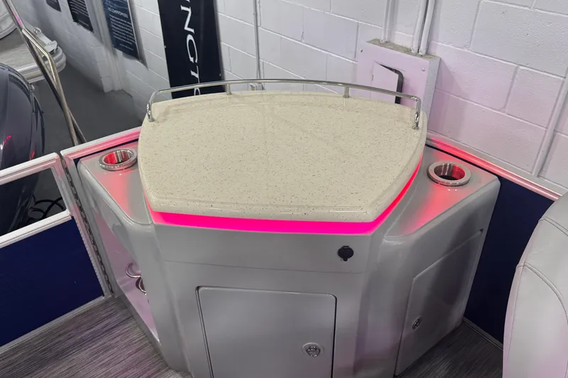 Slide: The Image of 2020 Bennington 23 SXPD boat interior with illuminated bar area and cup holders. - 21