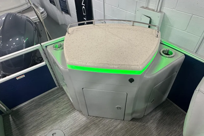 Slide: The Image of 2020 Bennington 23 SXPD boat interior with illuminated bar area and cup holders. - 22