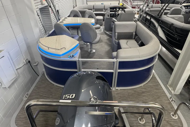 Slide: The Image of 2020 Bennington 23 SXPD pontoon boat interior with seating and Yamaha 150 engine. - 23