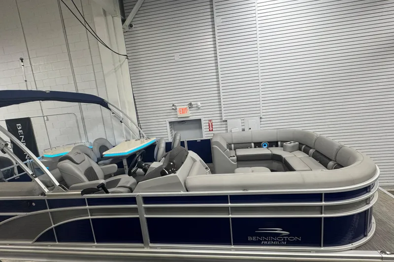 Slide: The Image of 2020 Bennington 23 SXPD pontoon boat with luxurious seating in a showroom. - 7