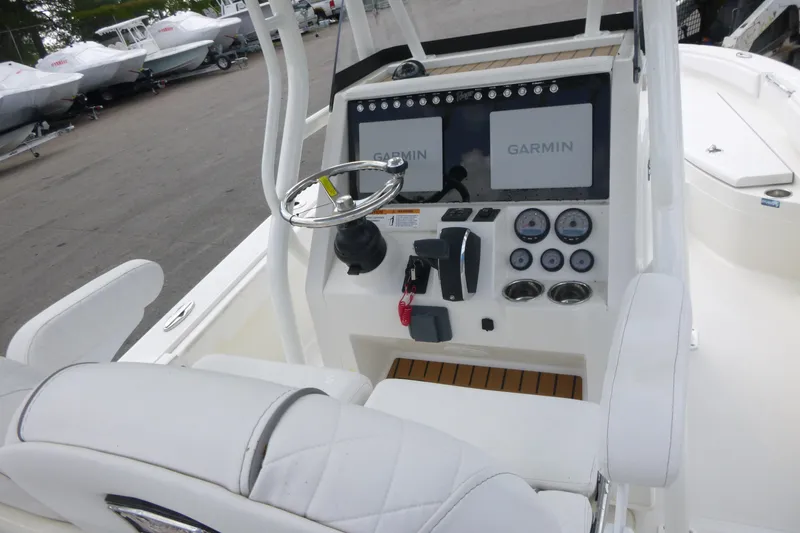 Slide: The Image of 2024 Ranger 2660 Bay boat console with Garmin displays and steering wheel. - 11