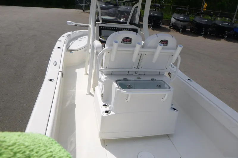 Slide: The Image of 2024 Ranger 2660 Bay boat interior with seating and storage compartments. - 4