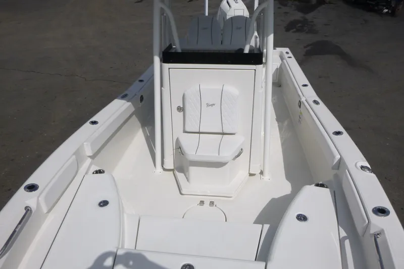Slide: The Image of 2024 Ranger 2660 Bay boat interior with white seating and spacious deck. - 5