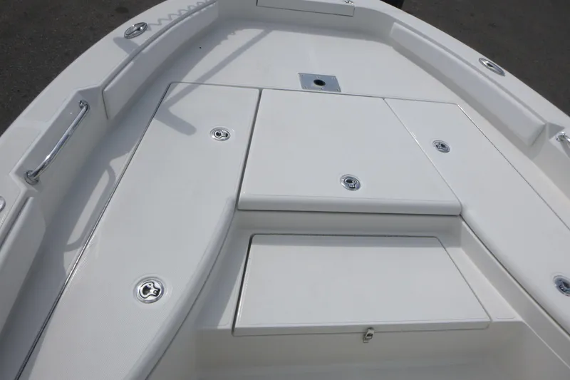 Slide: The Image of 2024 Ranger 2660 Bay boat deck with storage compartments and sleek design. - 6