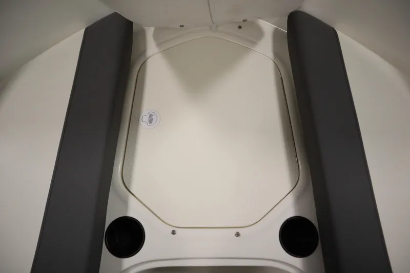 Slide: The Image of 2026 Bayliner Element E18 boat interior with seating and storage area. - 11