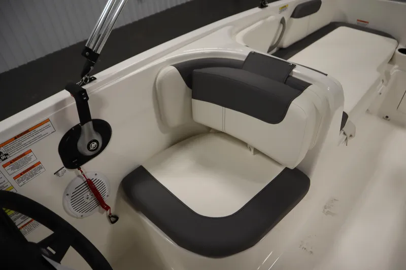 Slide: The Image of 2026 Bayliner Element E18 boat interior with cushioned seating and safety features. - 20