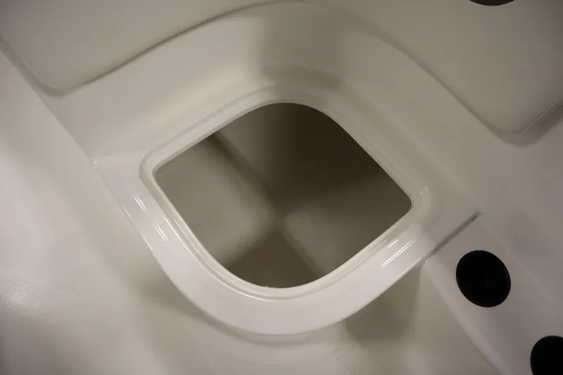 Slide: The Image of 2026 Bayliner Element E18 boat storage compartment, white interior detail. - 24