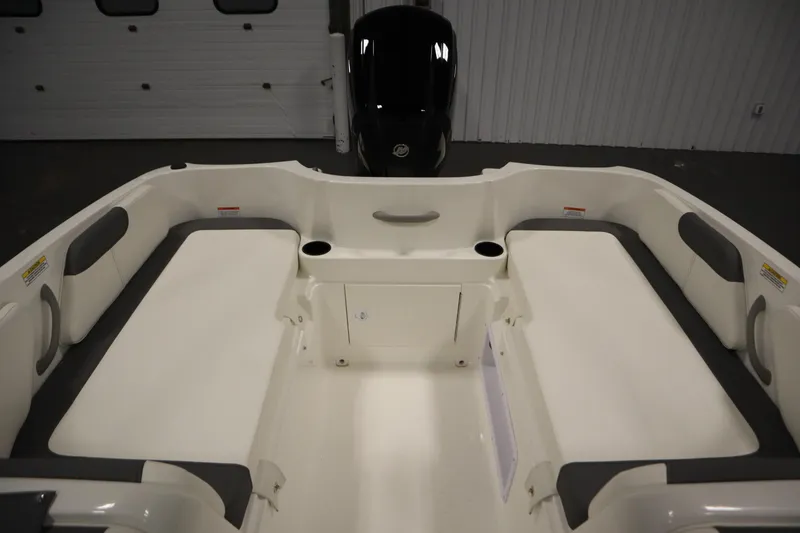 Slide: The Image of 2026 Bayliner Element E18 boat interior with spacious seating and cup holders. - 25