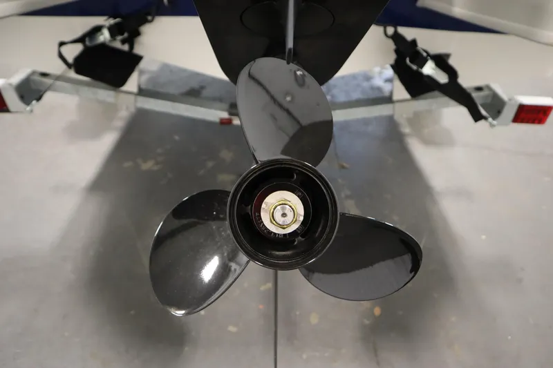 Slide: The Image of 2026 Bayliner Element E18 boat propeller on trailer, close-up view. - 31