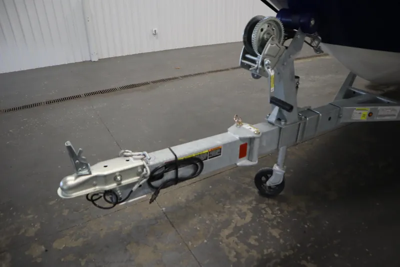 Slide: The Image of Trailer hitch of 2026 Bayliner Element E18 boat in a garage setting. - 32