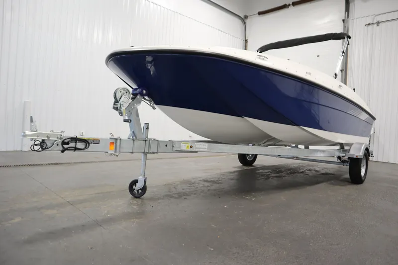 Slide: The Image of 2026 Bayliner Element E18 boat on trailer in indoor storage facility. - 33