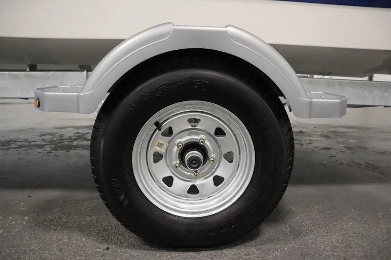 Slide: The Image of Trailer wheel of 2026 Bayliner Element E18 boat, close-up view. - 34