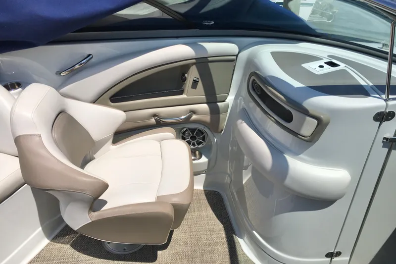 Slide: The Image of Interior of 2017 Crownline 275 SS boat with beige and white seating. - 10