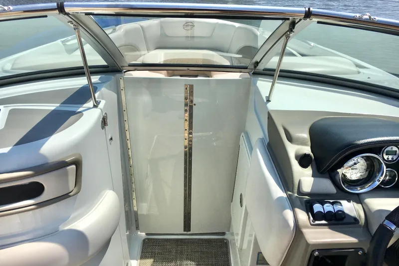 Slide: The Image of 2017 Crownline 275 SS boat interior with dashboard and seating area. - 11