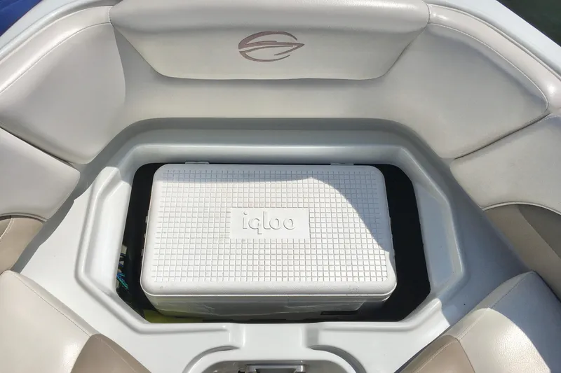 Slide: The Image of 2017 Crownline 275 SS boat with Igloo cooler in storage compartment. - 16