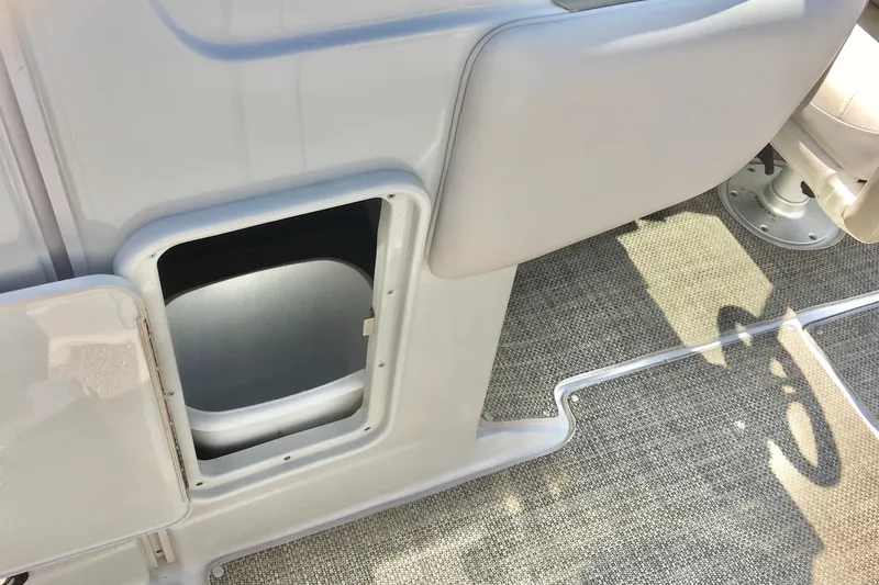 Slide: The Image of 2017 Crownline 275 SS boat interior storage compartment with open hatch. - 20