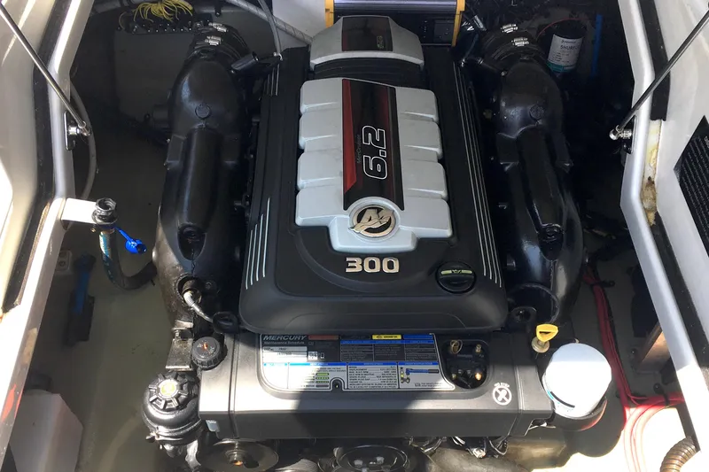 Slide: The Image of Engine compartment of a 2017 Crownline 275 SS boat featuring a Mercury 6.2L engine. - 22
