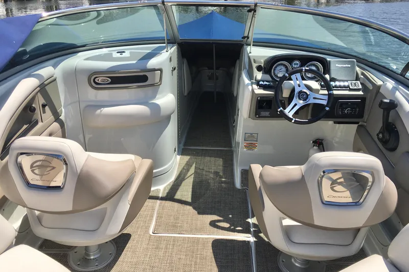 Slide: The Image of 2017 Crownline 275 SS boat interior with steering wheel and seating. - 6