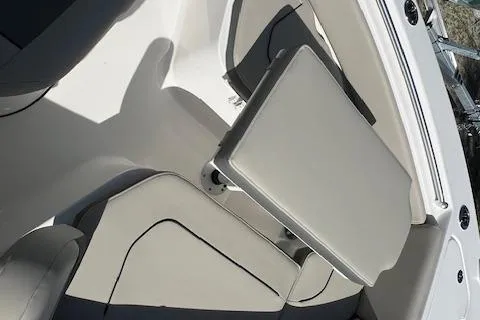 Slide: The Image of 2026 Key West 219 FS boat interior with cushioned seating and sleek design. - 11